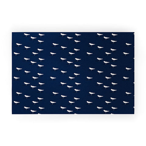 Little Arrow Design Co Sandpipers on navy Welcome Mat