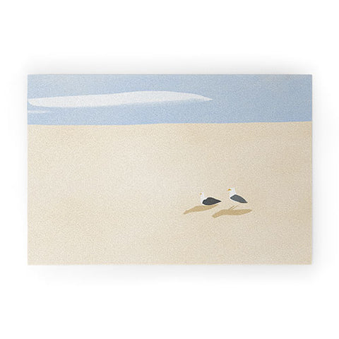Little Dean Minimal sand beach with seagull Welcome Mat