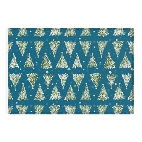 marufemia Holiday christmas tree over blue Outdoor Rug