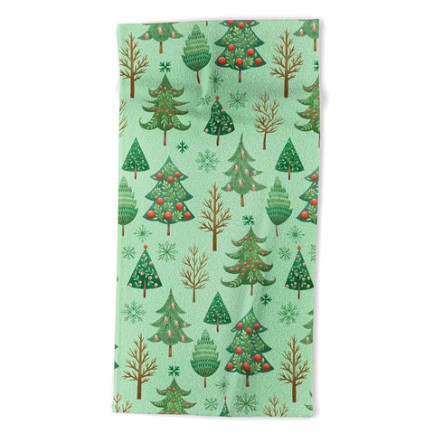 Pimlada Phuapradit Christmas trees snowflakes Beach Towel