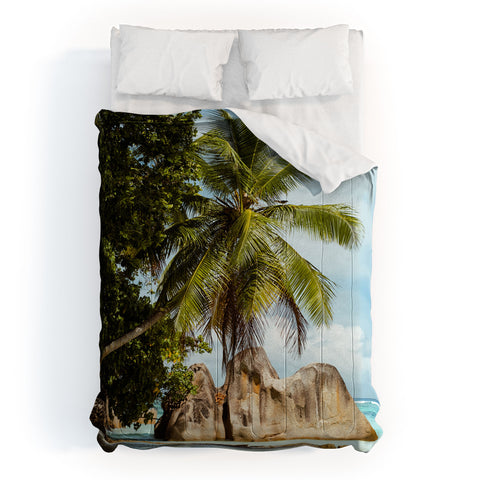 Pita Studios Palm tree bending over the sea Comforter