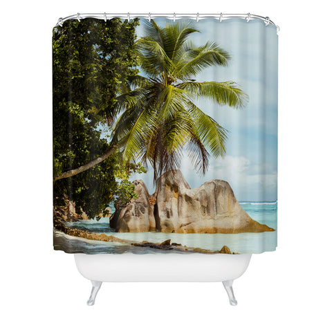 Pita Studios Palm tree bending over the sea Shower Curtain