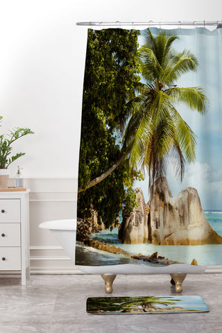 Pita Studios Palm tree bending over the sea Shower Curtain And Mat