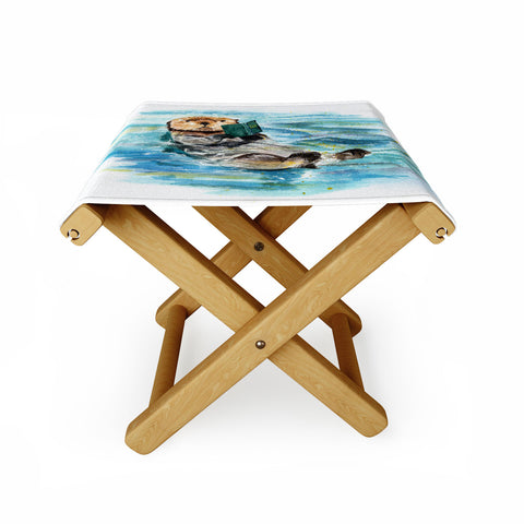 Anna Shell reading otter Folding Stool