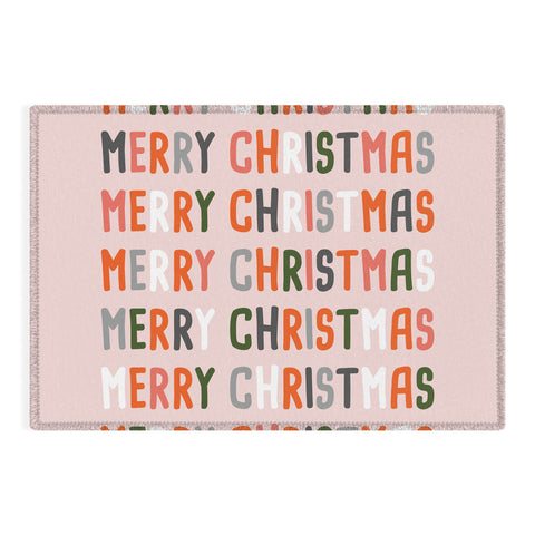 BlueLela Merry Christmas and Happy New Year Pink Outdoor Rug