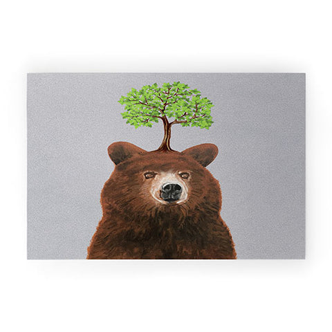 Coco de Paris A brown bear with a tree Welcome Mat