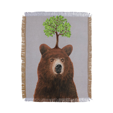 Coco de Paris A brown bear with a tree Throw Blanket