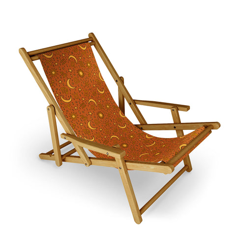 Doodle By Meg Zodiac Sun and Star Print Rust Sling Chair