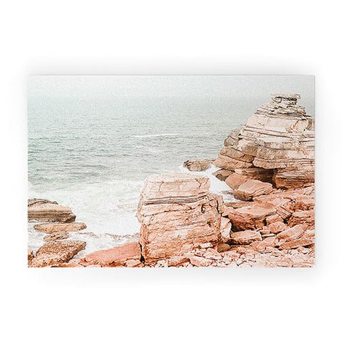Ingrid Beddoes Rocky coastline Welcome Mat