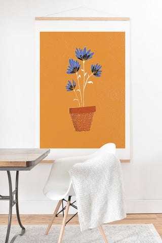 justin shiels blue flowers on orange background Art Print And Hanger