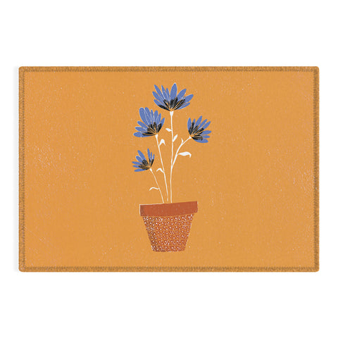 justin shiels blue flowers on orange background Outdoor Rug