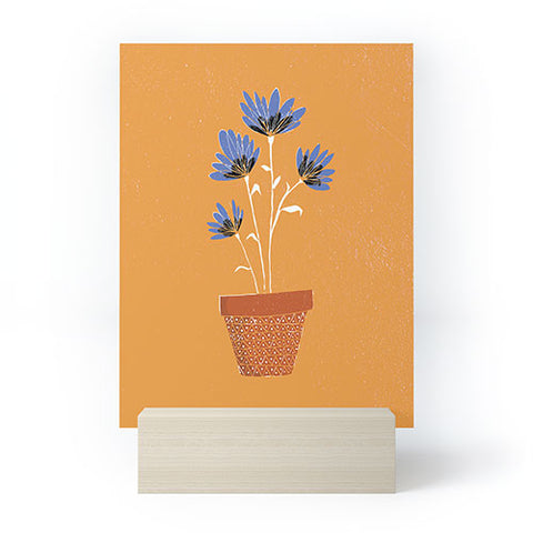 justin shiels blue flowers on orange background Mini Art Print