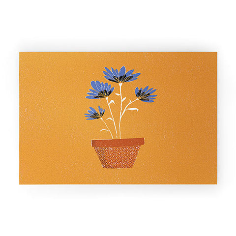 justin shiels blue flowers on orange background Welcome Mat