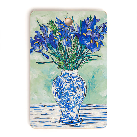 Lara Lee Meintjes Iris Bouquet in Chinoiserie Vase on Blue and White Striped Tablecloth on Painterly Mint Green Cutting Board Rectangle