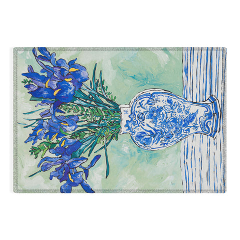 Lara Lee Meintjes Iris Bouquet in Chinoiserie Vase on Blue and White Striped Tablecloth on Painterly Mint Green Outdoor Rug