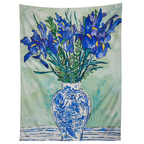 Lara Lee Meintjes Iris Bouquet in Chinoiserie Vase on Blue and White Striped Tablecloth on Painterly Mint Green Tapestry