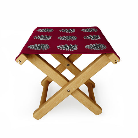 Lisa Argyropoulos Monochrome Pine Cones and Red Folding Stool