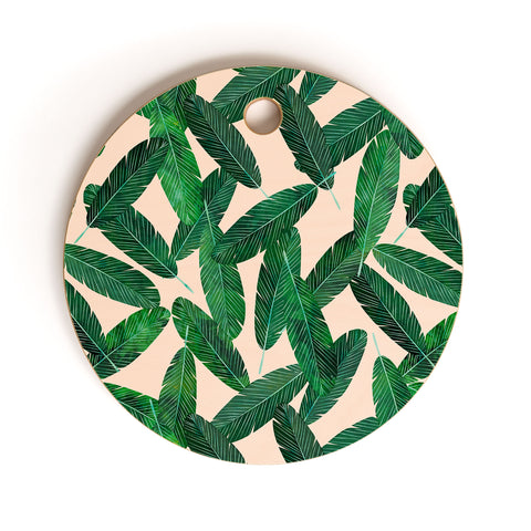 Little Arrow Design Co banana leaves on blush Cutting Board Round