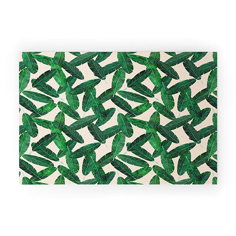 Little Arrow Design Co banana leaves on blush Welcome Mat