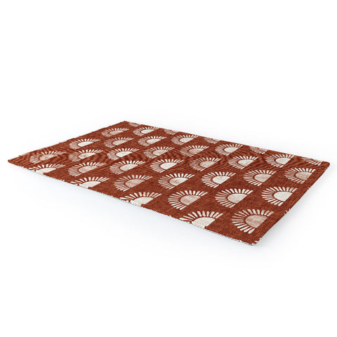 Little Arrow Design Co block print suns on rust Area Rug