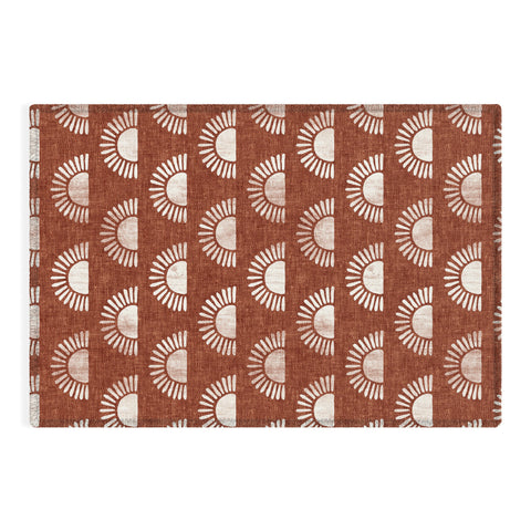 Little Arrow Design Co block print suns on rust Outdoor Rug