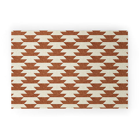 Little Arrow Design Co boho geometric aztec in ginger Welcome Mat