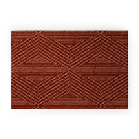 Little Arrow Design Co boho triangle stripes rust Welcome Mat