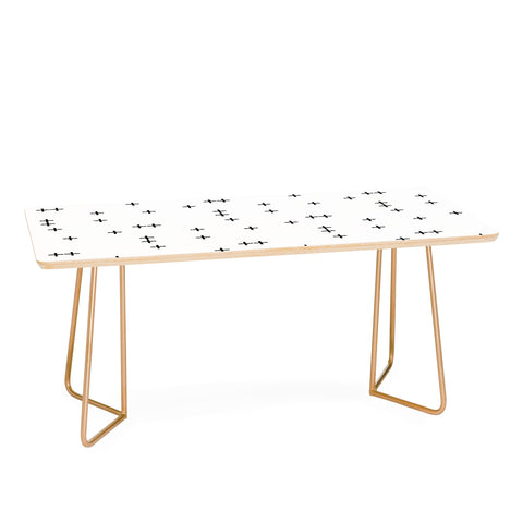 Little Arrow Design Co Cross on White Coffee Table