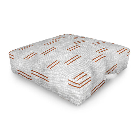 Little Arrow Design Co double dash rust on greige Outdoor Floor Cushion