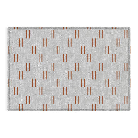 Little Arrow Design Co double dash rust on greige Outdoor Rug