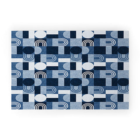 Little Arrow Design Co geometric patchwork blue Welcome Mat