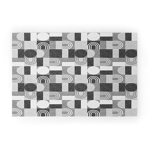 Little Arrow Design Co geometric patchwork gray Welcome Mat