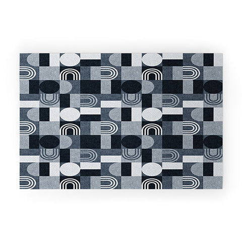 Little Arrow Design Co geometric patchwork navy Welcome Mat