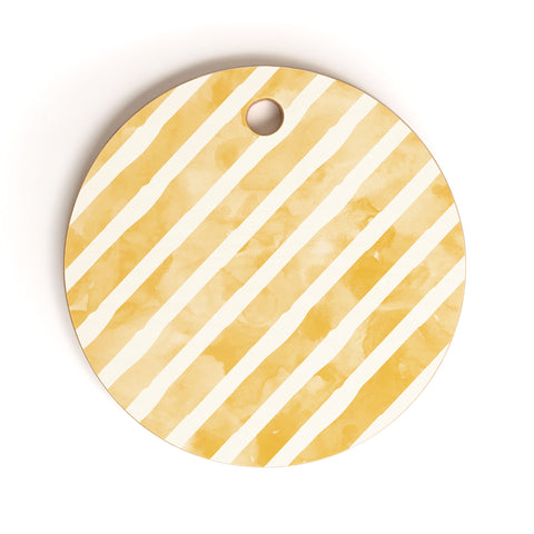 Little Arrow Design Co gold watercolor stripes diagonal Cutting Board Round