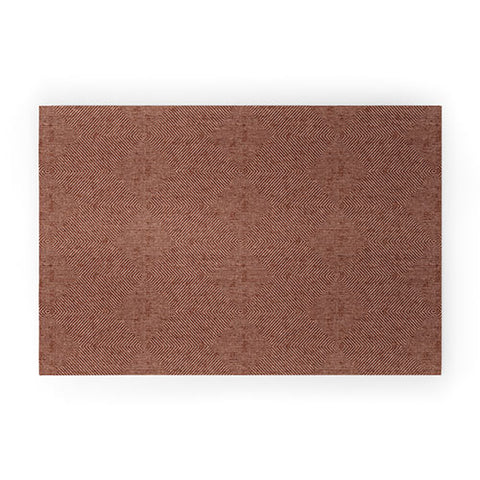 Little Arrow Design Co hexagon stripes rust Welcome Mat
