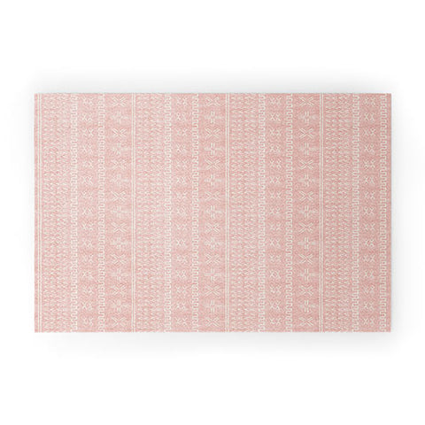 Little Arrow Design Co mud cloth arrow cross pink Welcome Mat