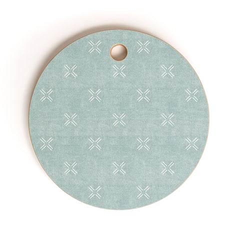Little Arrow Design Co mud cloth cross dusty blue Cutting Board Round