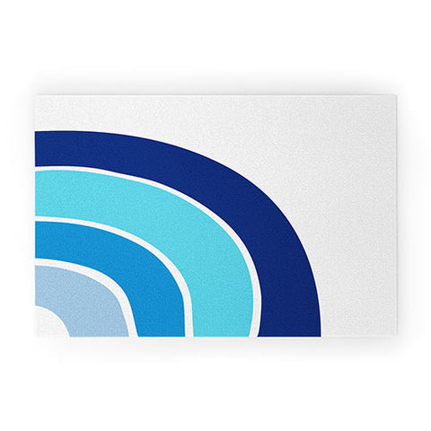 Little Arrow Design Co rainbow in blue Welcome Mat