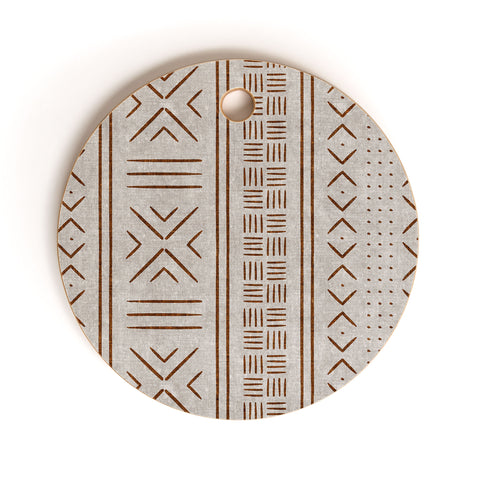 Little Arrow Design Co rust stone mudcloth tribal Cutting Board Round