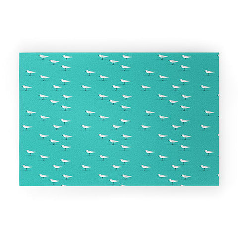 Little Arrow Design Co Sandpipers on teal Welcome Mat