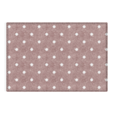 Little Arrow Design Co stars on mauve Outdoor Rug