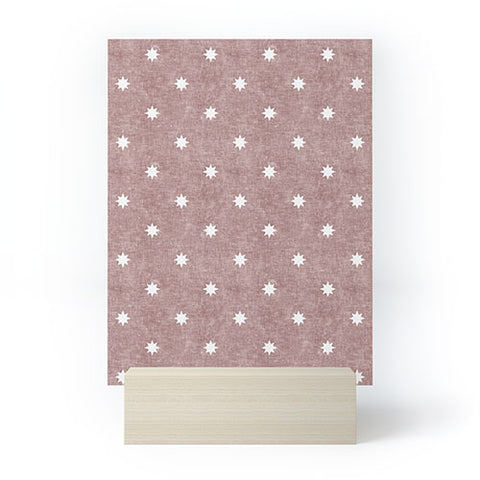 Little Arrow Design Co stars on mauve Mini Art Print