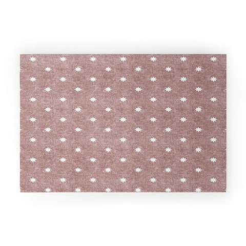 Little Arrow Design Co stars on mauve Welcome Mat