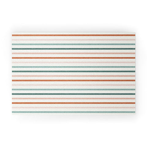 Little Arrow Design Co sunset stripes in terra cotta Welcome Mat