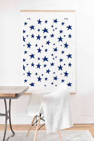Little Arrow Design Co unicorn dreams stars in blue Art Print And Hanger