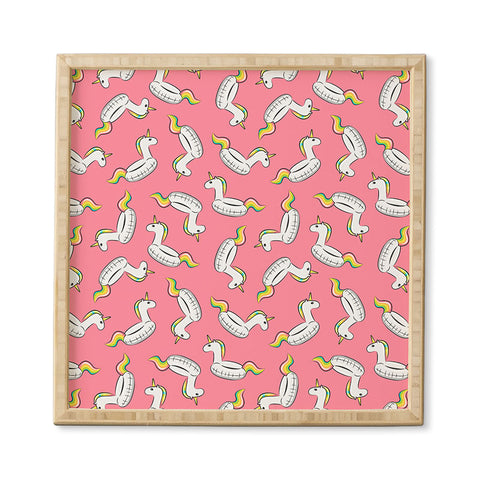 Little Arrow Design Co unicorn pool float on pink Framed Wall Art