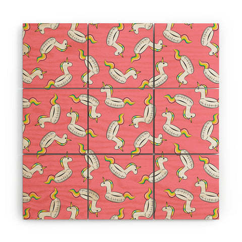 Little Arrow Design Co unicorn pool float on pink Wood Wall Mural