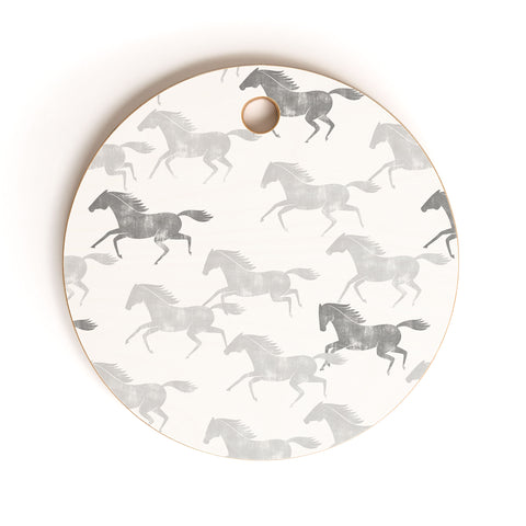 Little Arrow Design Co wild horses gray Cutting Board Round