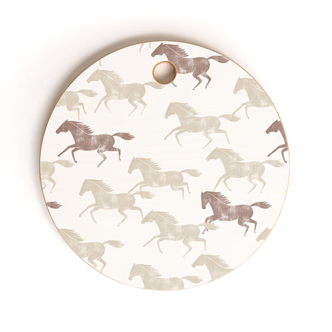 Little Arrow Design Co wild horses tan Cutting Board Round