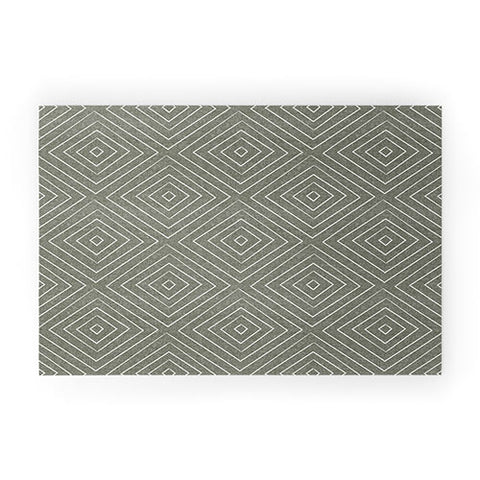 Little Arrow Design Co woven diamonds olive Welcome Mat